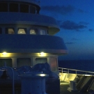 Panoramic view of the foredeck of the Shadow at dusk.