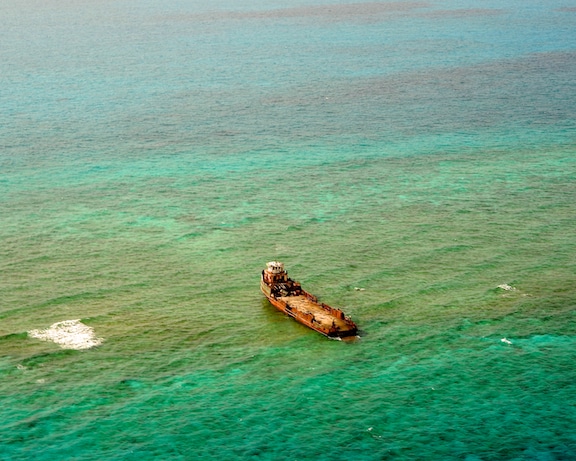 The inter-island freight ship, Lady Eagle, resting high and dry up on Hogsty Reef, Bahamas 