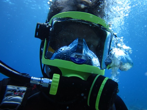 Mike wearing a full face mask with a transmitter that allows for communication with other divers.