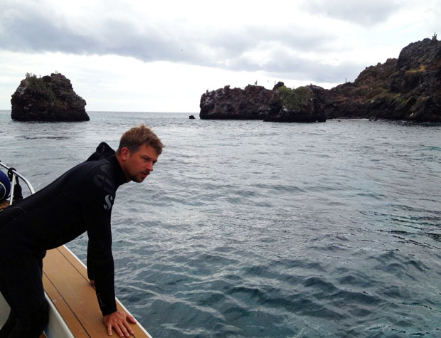 Brian Beck checks for surfacing divers