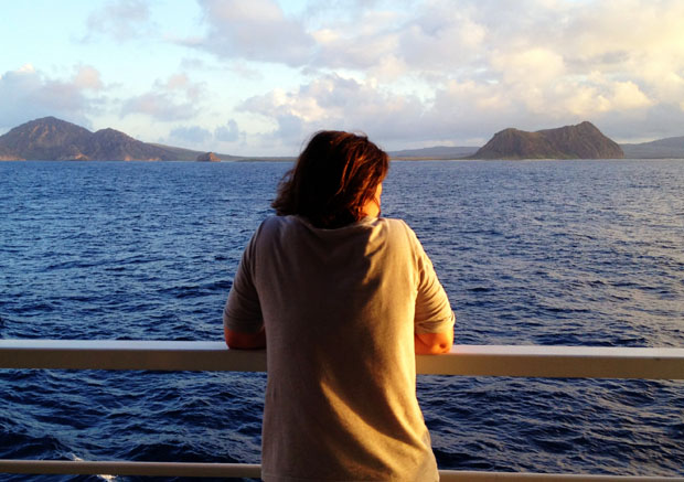 Iliana Burns watches the sun set over Isabela Island