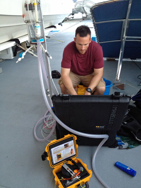Derek Manzello checks carbon dioxide (CO2) levels in a seawater sample