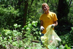 Dr. Andy Bruckner filling one of many garbage bags during our wetland urban cleanup