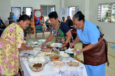 Silika Ngahe, the officer in charge of fisheries for Vava'u, celebrates the hand over with food and fellowship after the event.
