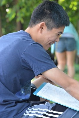 NOSB Marine Science Competition student happily documents coral reef survey data.jpg