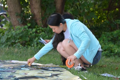 NOSB Marine Science Competition student measures a fish during the fish survey.