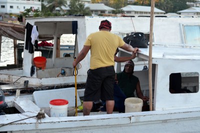 Spear fishermen at shore following a night's fishing.