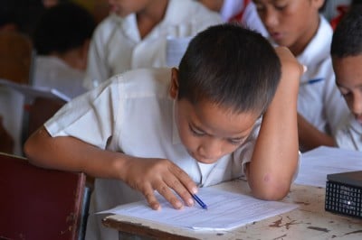 Education Research in Tonga: School student answers qustions on a marine education survey.