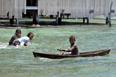 Kia Village Children Play in the Ocean