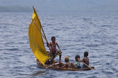 Kia Village traditional dugout canoe with sails.