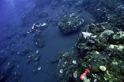 Science scuba diver surveys the underslope of Tinakula active volcano at Solomon Islands.