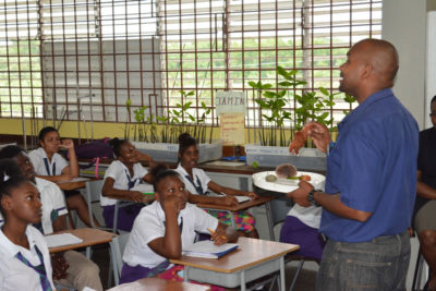 UWI partner explains phylum echinodermata to Jamaican students