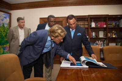 Dr Andy Bruckner Showing Off the Atlas to the Prime Minister