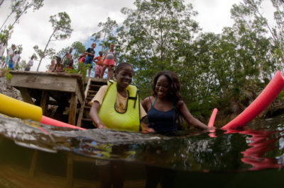 Sawmill Friends Day - Student swims in blue hole for the first time