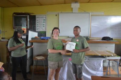 Marsden receiving Certificate of Participation for the JAMIN program from the Foundation’s Director of Education.