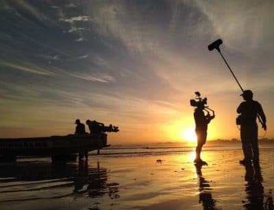 Fishermen gather on the beach at dawn to prepare for a day of fishing